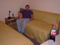Robert testing out Greigâ€™s sofa at the Barrancas apartment