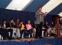 Greig giving tent testimony