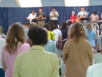 Pastors uniting on stage in Gotlob
